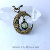 Crescent Moon With Face Caged Orb Glow Locket Antiqued Brass