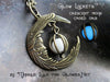 Crescent Moon With Face Caged Orb Glow Locket Antiqued Brass