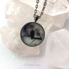 Black Raven in Tree with Real Full Moon Glow Necklace