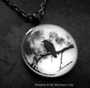 Black Raven in Tree with Real Full Moon Glow Necklace