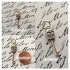 Smiling Skeleton Key Charm